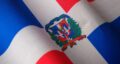 Close-up of the Dominican Republic flag featuring its emblem, symbolizing national pride.